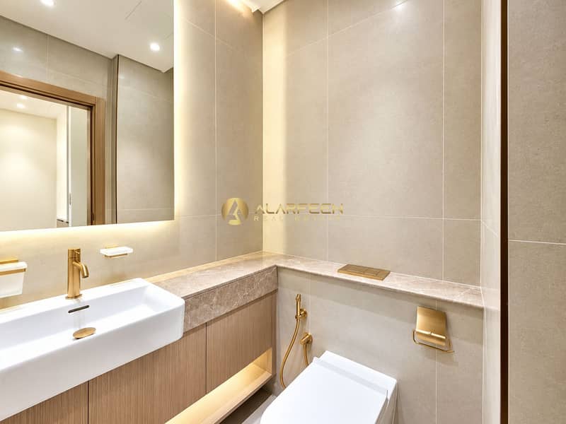 6 Luxurious Beige Bathroom with Brass Accents. jpeg