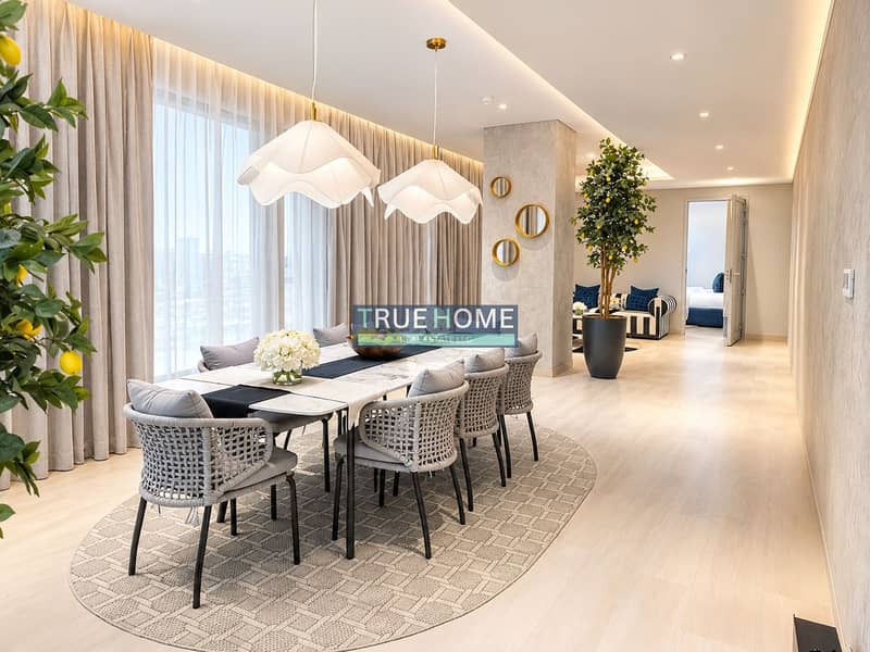 2 Luxurious Dining Room with Rattan Seating and Greenery. png