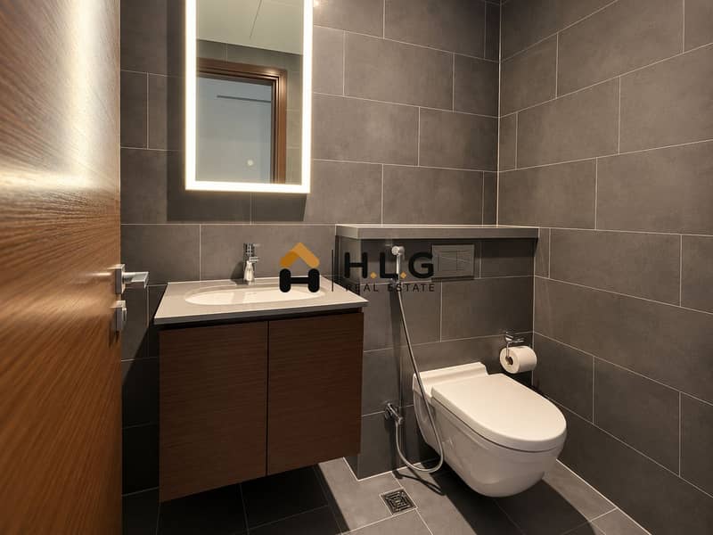 13 Modern Gray Tile Bathroom with Floating Vanity. png