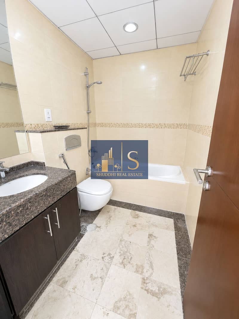 8 Bright Modern Beige Tile Bathroom (1). png