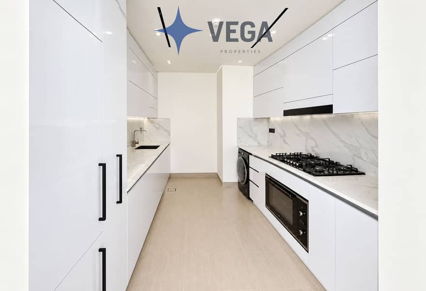 18 Minimalist White Marble Galley Kitchen. png