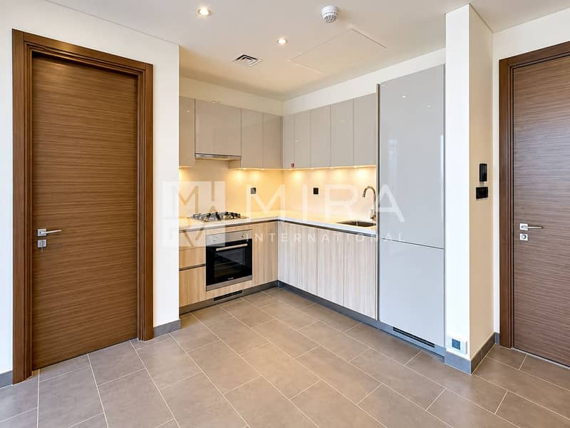3 Modern Minimalist Kitchen Framed by Wood Doors
