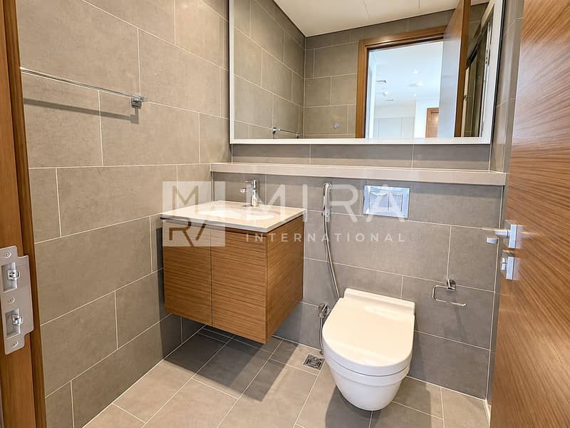 11 Modern Gray Tile Bathroom with Warm Wood Vanity