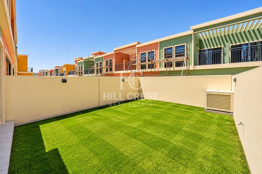 3 Sunlit Courtyard Amid Colorful Townhouses. png