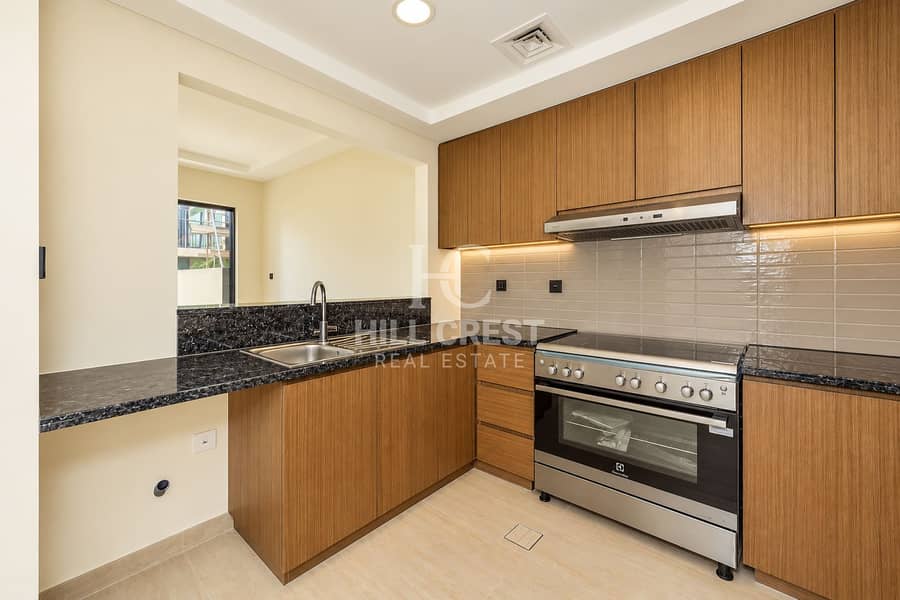 6 Modern Warm-Toned L-Shaped Kitchen. png