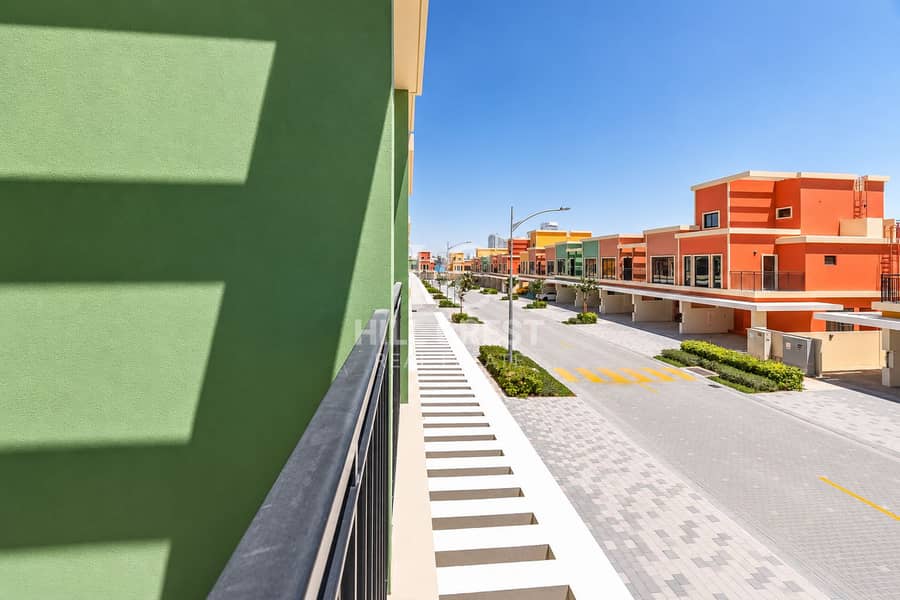 19 Sunny Colorful Townhouse Street. png