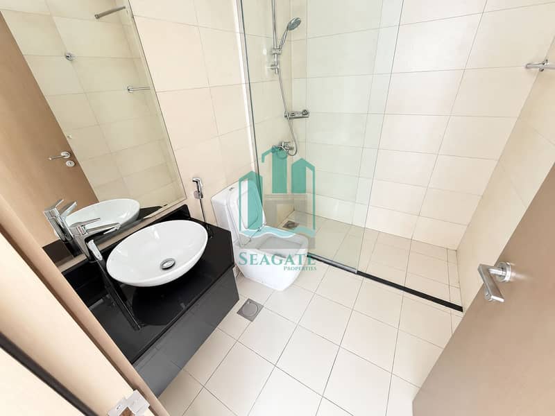 15 Bright Modern Cream-Tiled Bathroom. png