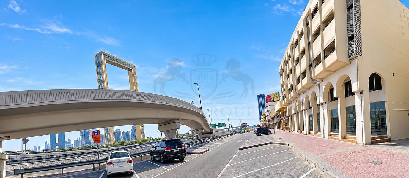 4 Sunlit Dubai Street with Overpass and Frame. png
