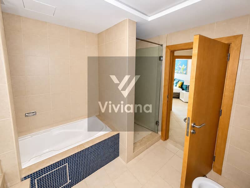 14 Modern Beige Bathroom with Bedroom View. png