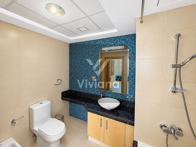 18 Modern Beige and Blue Mosaic Bathroom. png