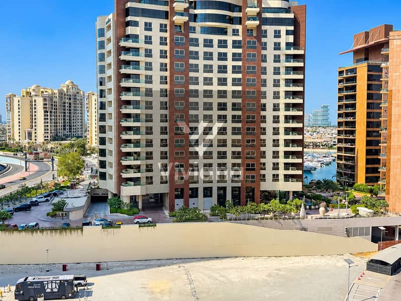 20 Sunlit Modern Tower by the Marina. png
