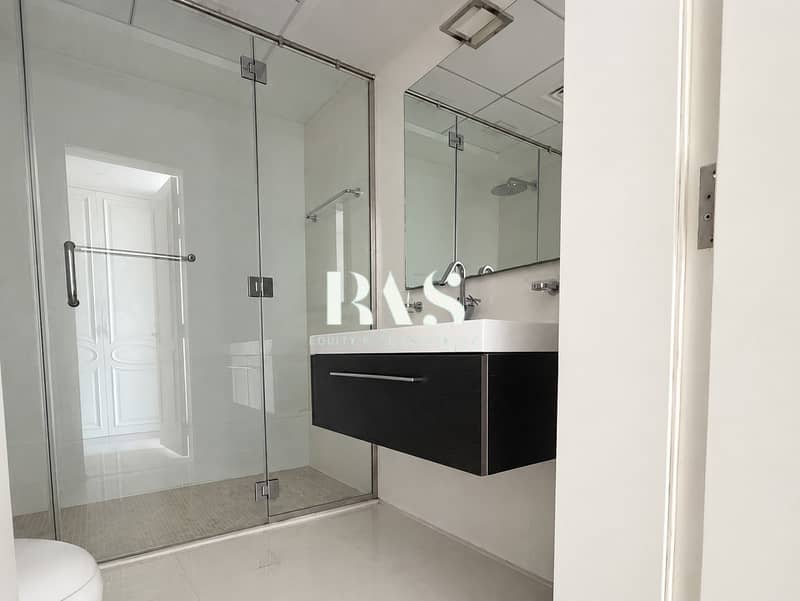 14 Modern Minimalist Bathroom with Glass Shower. png