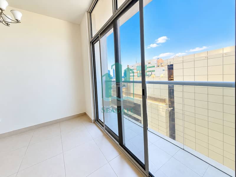 10 Bright Modern Room with City Balcony View. png