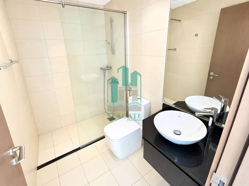 13 Bright Modern Bathroom with Glass Shower. png