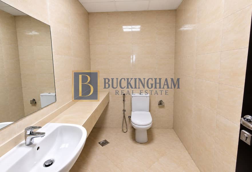 5 Minimalist Beige-Tiled Bathroom Interior. png