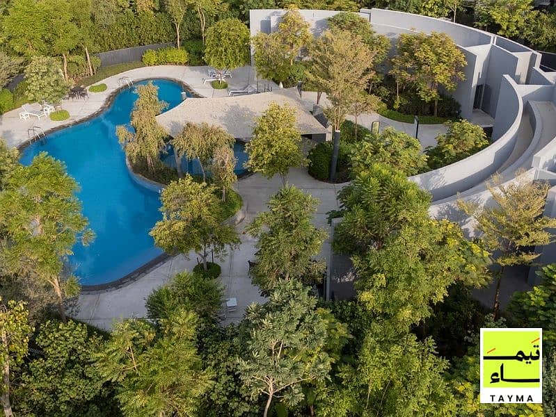 9 09 - Villa A - Central Lagoon Pool Aerial - 09. jpg