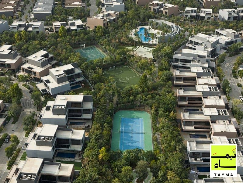 16 16 - Villa A - Community Green Spine Aerial 01 - 16. jpg