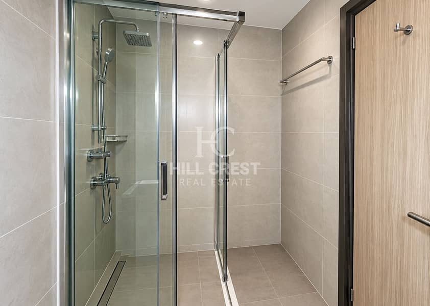 12 Modern Glass Shower with Chrome Fixtures. png