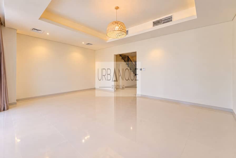 5 Minimalist Cream Living Room with Rattan Pendant. png