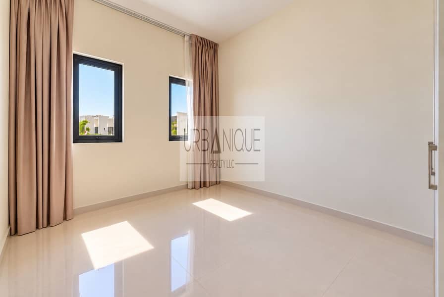 6 Sunlit Minimalist Room with Reflective Floors. png