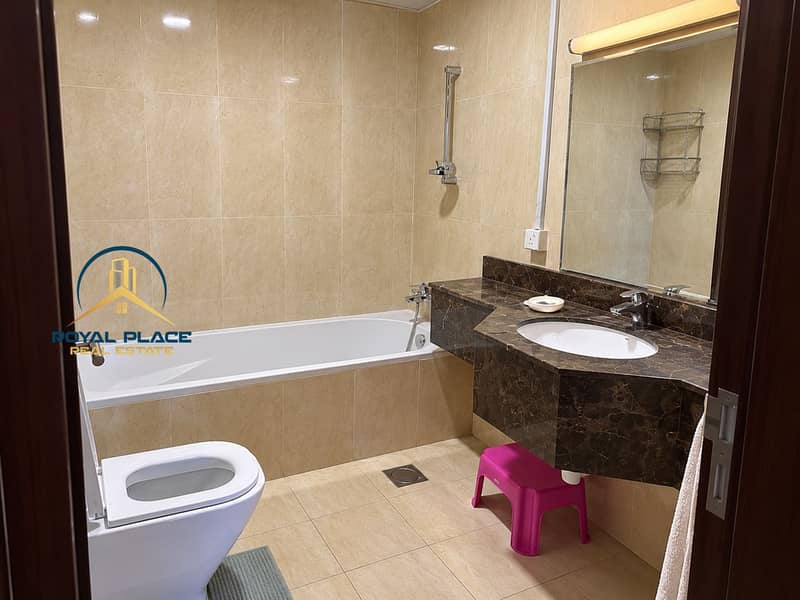9 Modern Marble Bathroom with Pink Stool. png