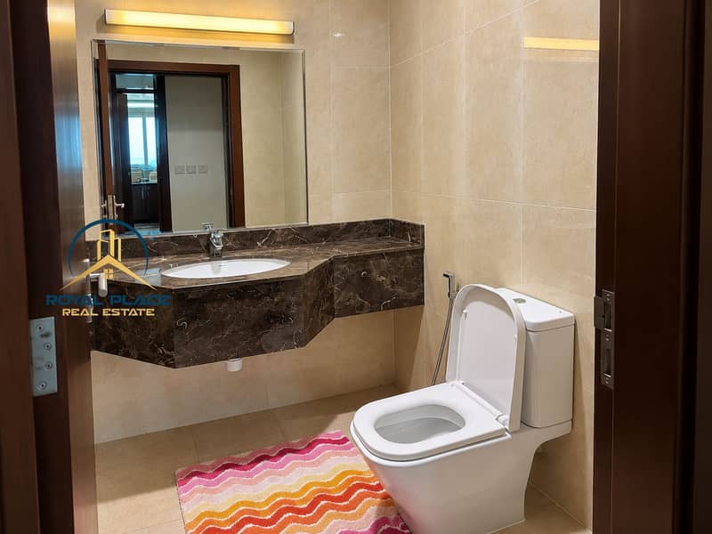 11 Modern Marble Bathroom with Colorful Bath Mat. png