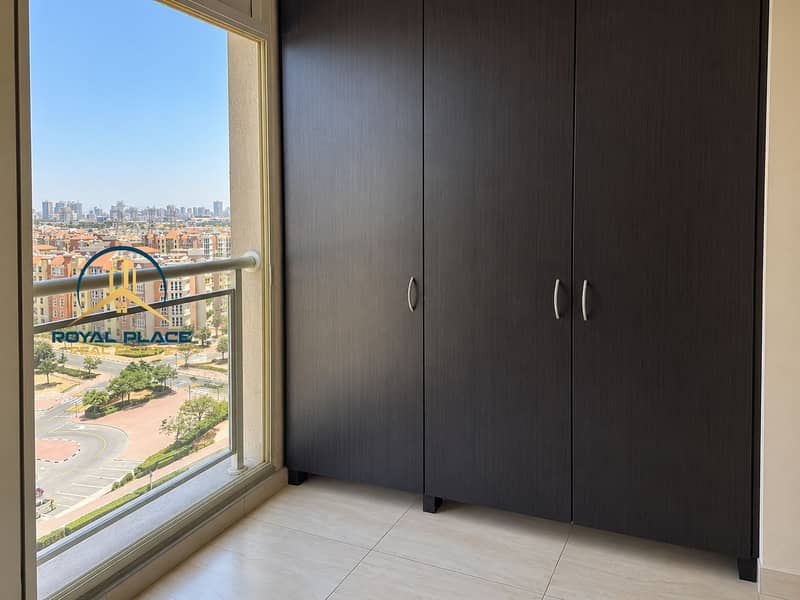 12 Modern Wardrobe Overlooking a Sunlit City. png