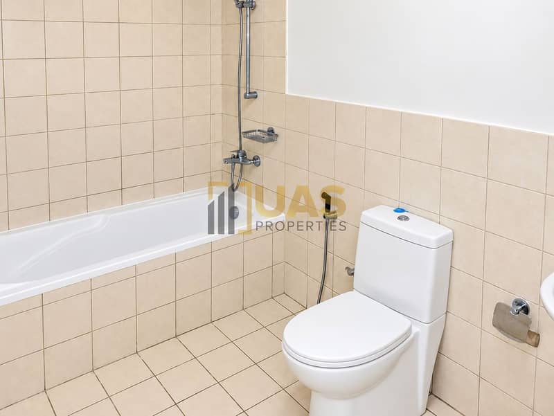 8 Bright beige tile bathroom. png