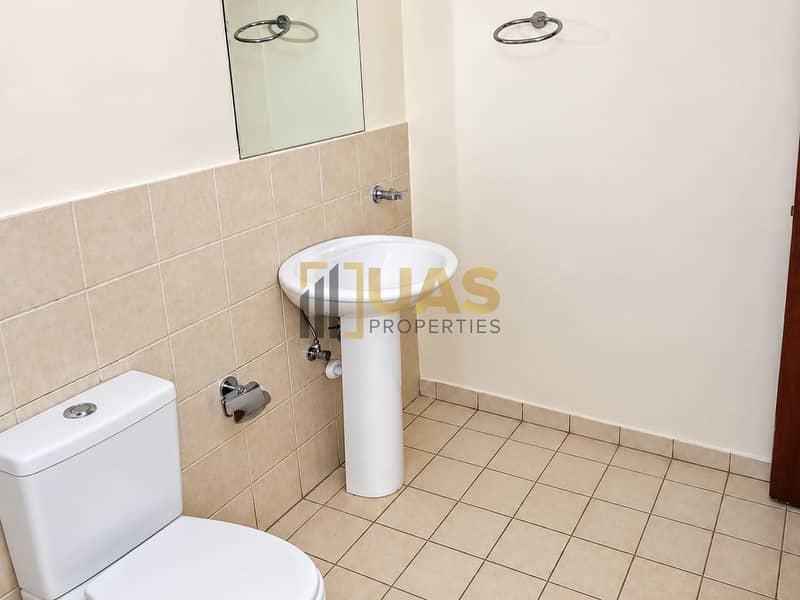 9 Bright Beige-Tile Bathroom. png