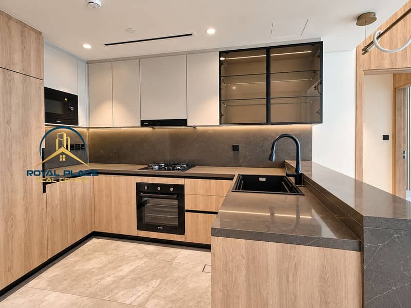 3 Modern Oak Kitchen with Charcoal Stone Accents (1). png