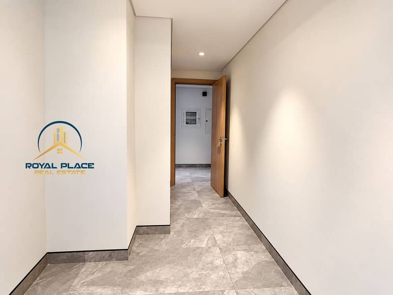 11 Modern Marble Hallway with Open Wooden Door. png