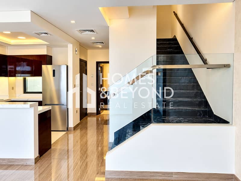 12 Modern Kitchen and Glass Staircase Interior. png