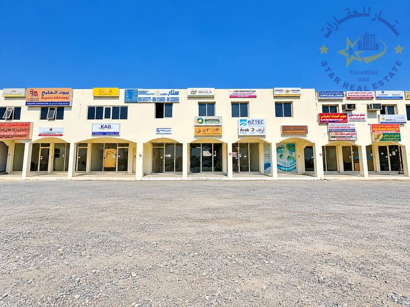 2 Bilingual Commercial Plaza Under Blue Skies. png