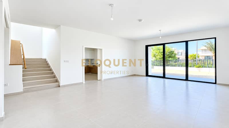 2 Bright Minimalist Living Space with Sliding Glass Doors. png