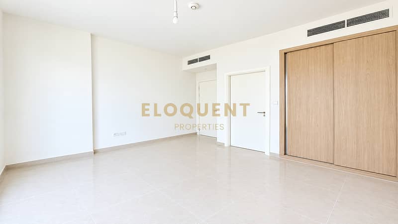 12 Bright Minimalist Room with Oak Closets. png