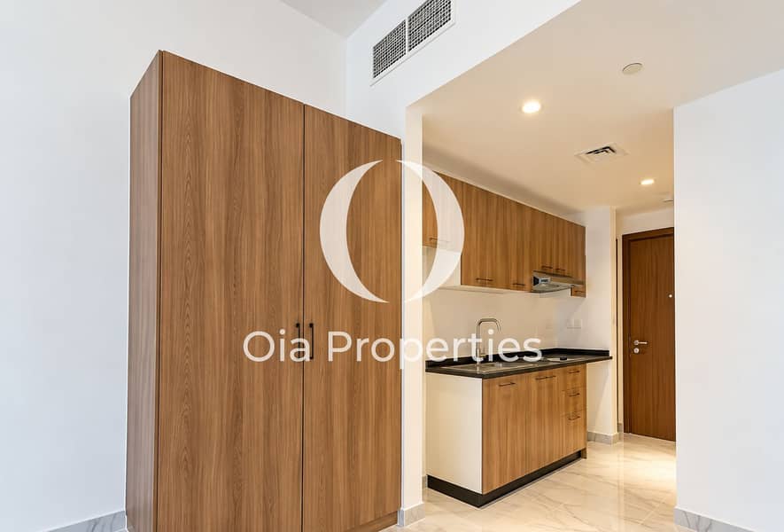 5 Modern Wood-Toned Entry Kitchenette. png