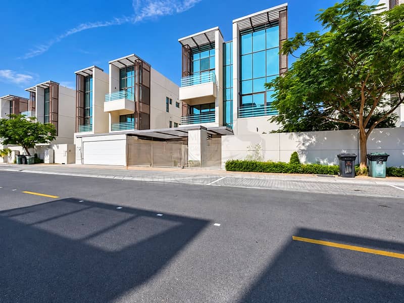 16 Modern Townhouses Under a Blue Sky. png