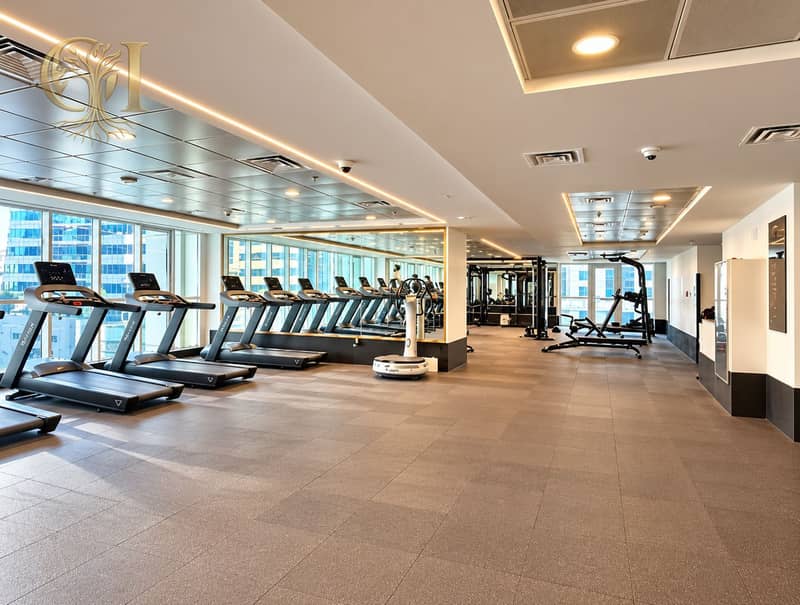 15 Bright Modern Gym Interior with City Views. png
