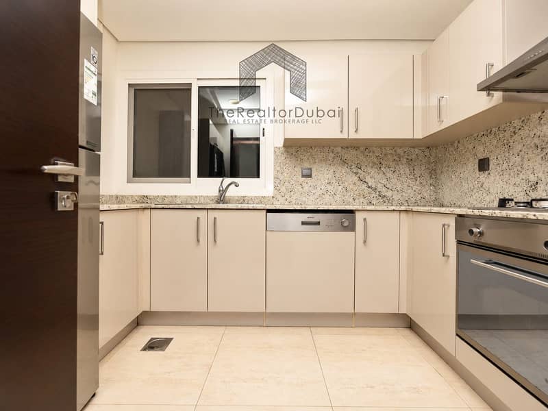 5 Modern Beige Kitchen with Stainless Appliances. png