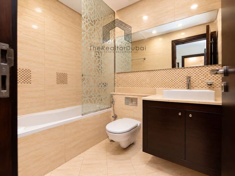 13 Modern Beige Bathroom with Mosaic Accents. png