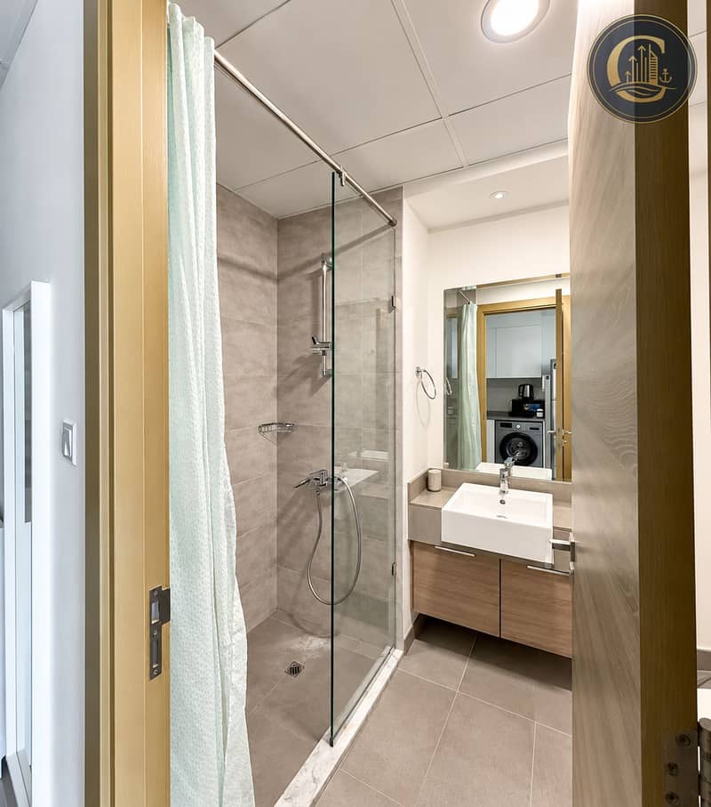 9 Modern Gray-Tiled Ensuite Bathroom. png