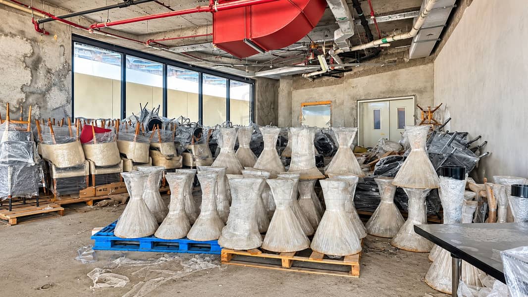 17 Wrapped Furniture in an Industrial Storage Room. png