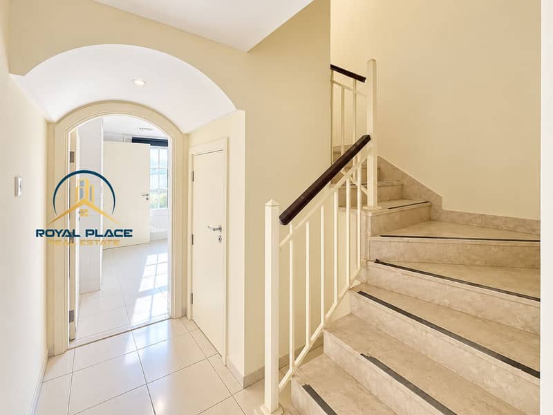 5 Bright Cream Foyer with Marble Staircase. png
