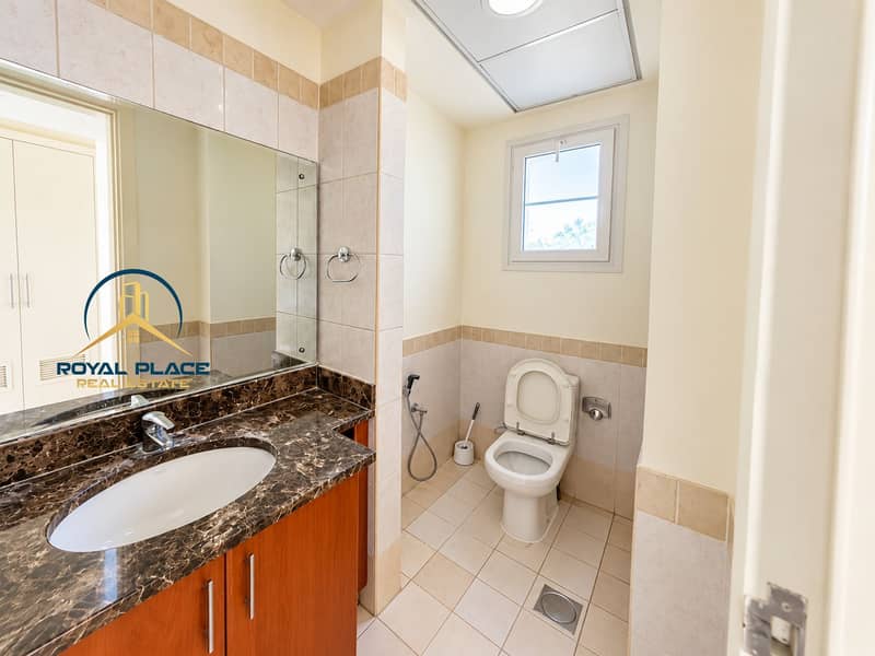 13 Modern Beige-Tiled Bathroom Interior. png