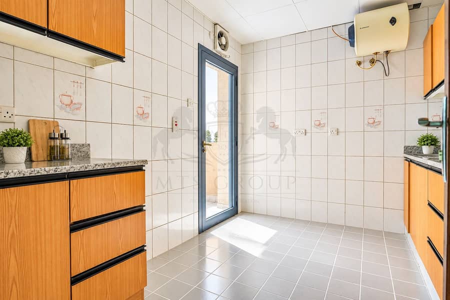 8 Bright Modern Kitchen with Sunlit Door. png