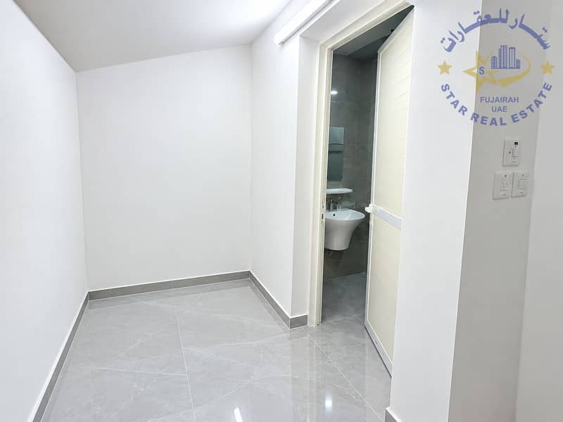 11 Minimalist White Hallway with Open Bathroom Door. png