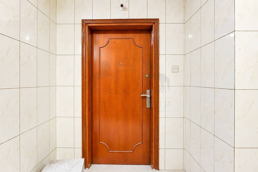 5 Symmetrical Marble Entryway with Wooden Door. png