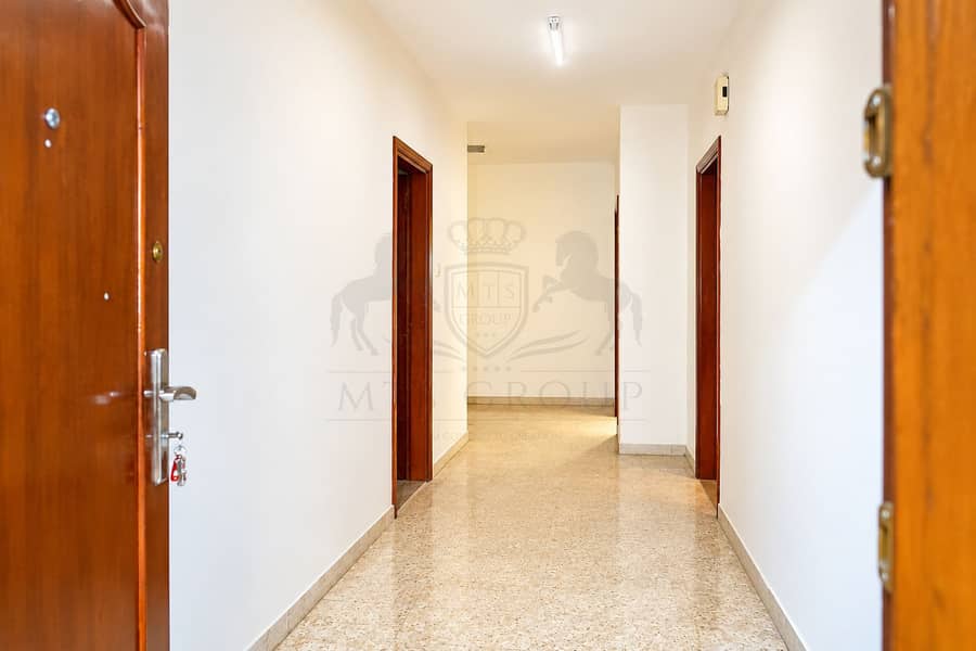 4 Bright Residential Hallway with Open Doors. png