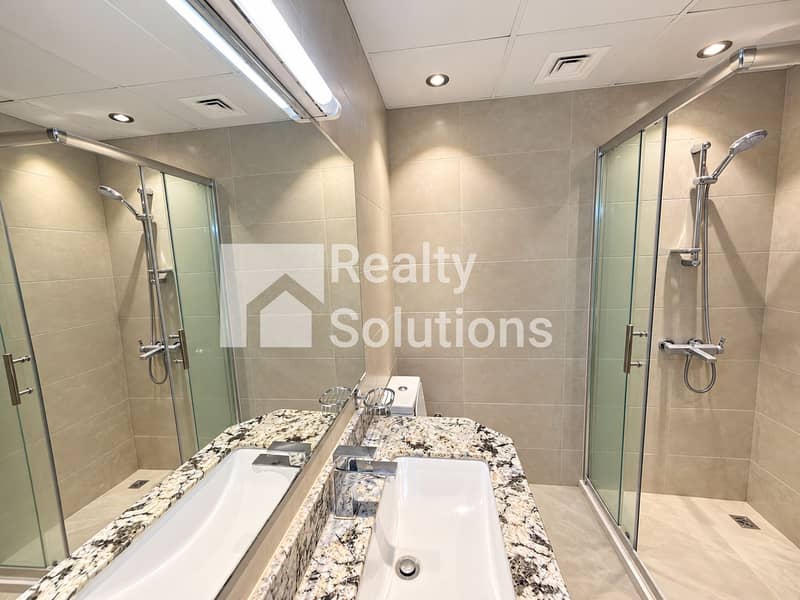 14 Modern Symmetrical Hotel Bathroom. png