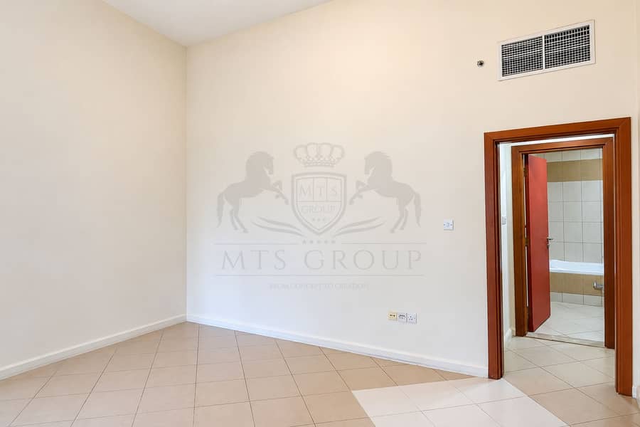 3 Bright Empty Room with Open Bathroom Door. png